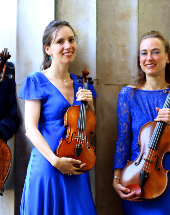 An image of four musicians playing as part of KCMS series