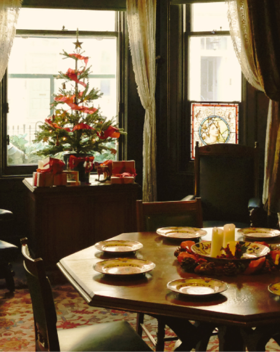 An image of the dining room at Sambourne House with Christmas decorations
