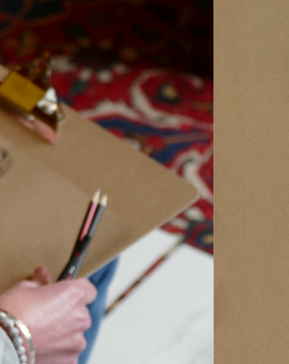 A lady sketching in Leighton's studio, a chalk study by Frederic Leighton