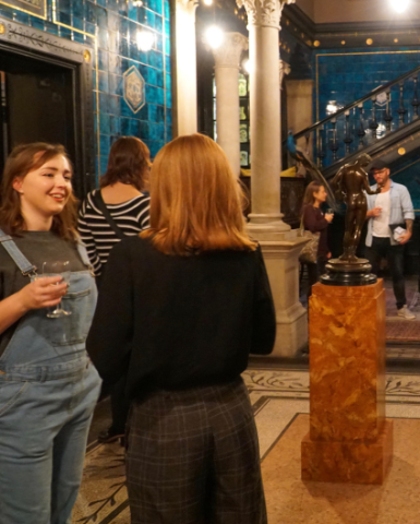 A group of young people enjoying a late evening at Leighton House