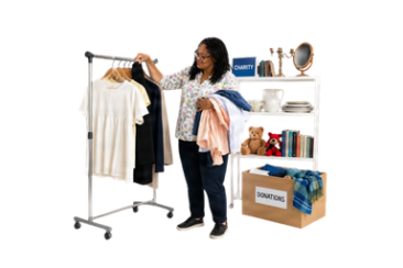 Person sorting clothes and household items for donation