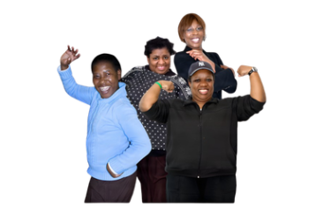 Four people posing together with their arms raised in a celebratory gesture