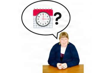 Person sitting at a desk with a speech bubble above them containing a calendar and a clock