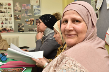 Smiling woman taking part in a Westway Trust learning class