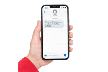 Person receiving a reminder message on a mobile phon