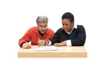 Two people filling in a form together