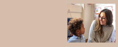 A woman smiling and a young child