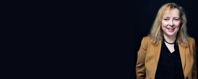 Portrait of Mel Byron on a black background