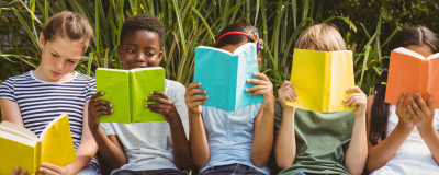 Group of children reading book