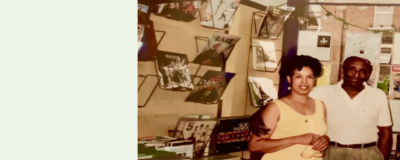 Man and woman standing in record shop.