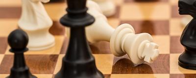 pile of chess pieces on a chess board