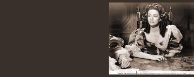 A woman with dark hair sat at an desk