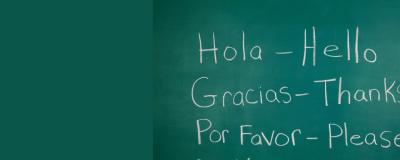 the Spanish words hola, gracias, por favor written in white against a green backround