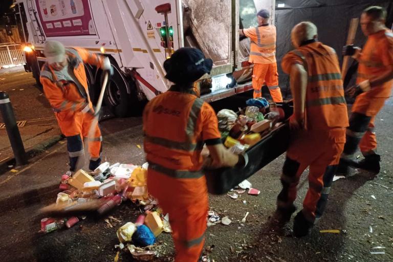 Refuse workers clean the streets during Notting Hill Carnival