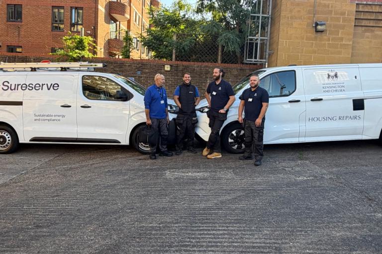 4 men in uniform standing infront of a sureserve van and an rbkc van