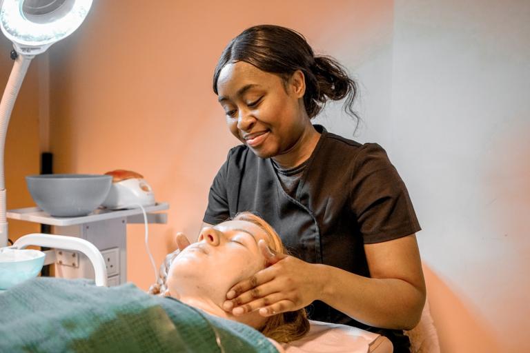 Beam-supported resident working as a beauty therapist