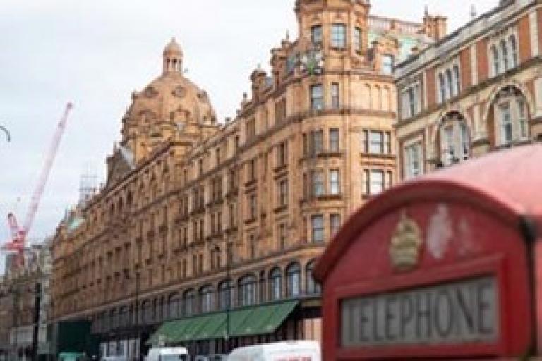 Shops along Brompton Road with a London phonebox