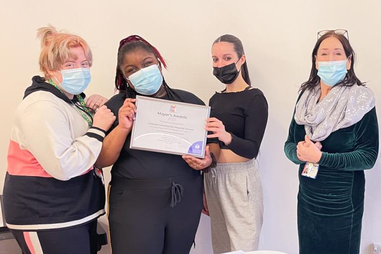 2021 Mayor's Awards winners with certificate