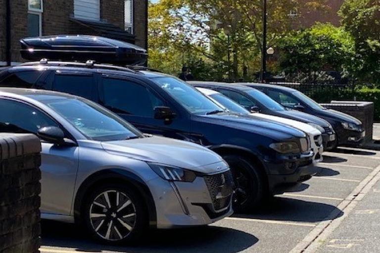 Image of a row of cars parked in parking bays on an estate.