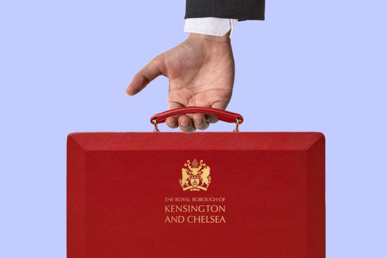 Image of a person's arm in a suit, holding a red briefcase which has the Kensington and Chelsea logo on it