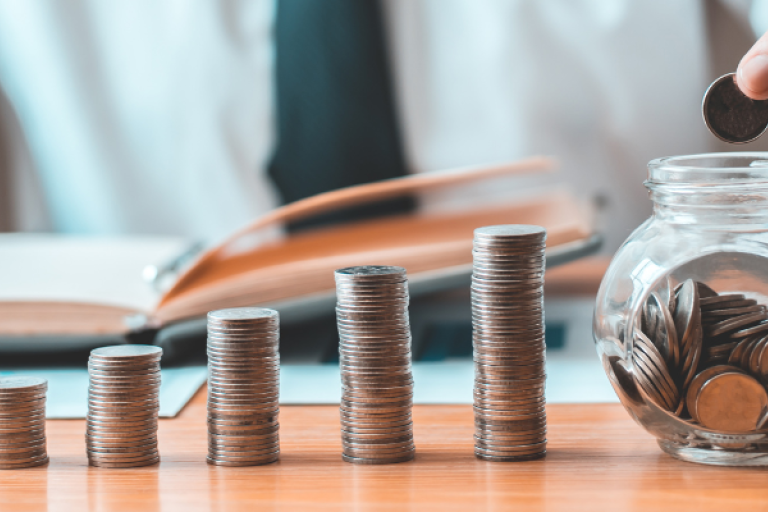 a person counting coins