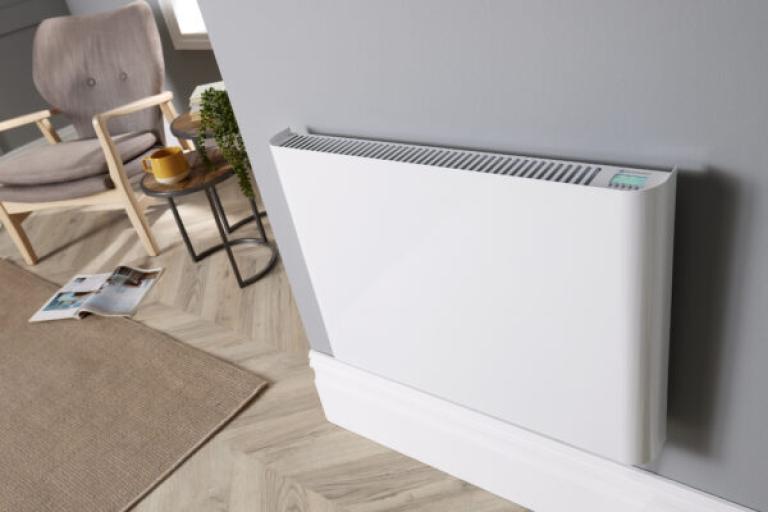 white wall mounted electric heater on grey wall