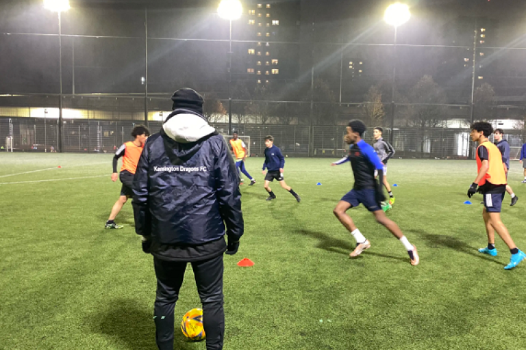 A group of people playing football
