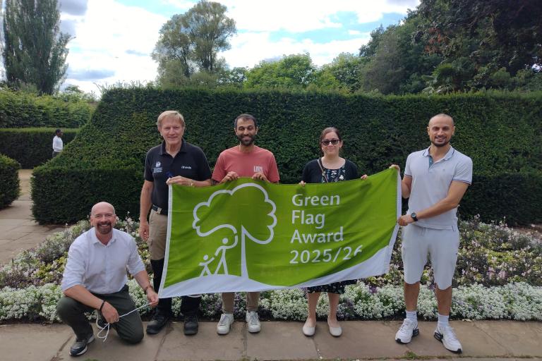 Five members of the parks team with a 2025 Green Flag