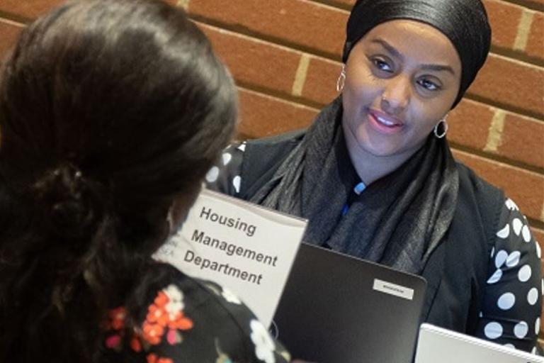 Image of a two ladies talking to each other