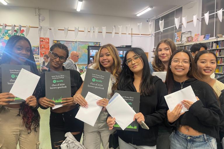 A group of students show off their results