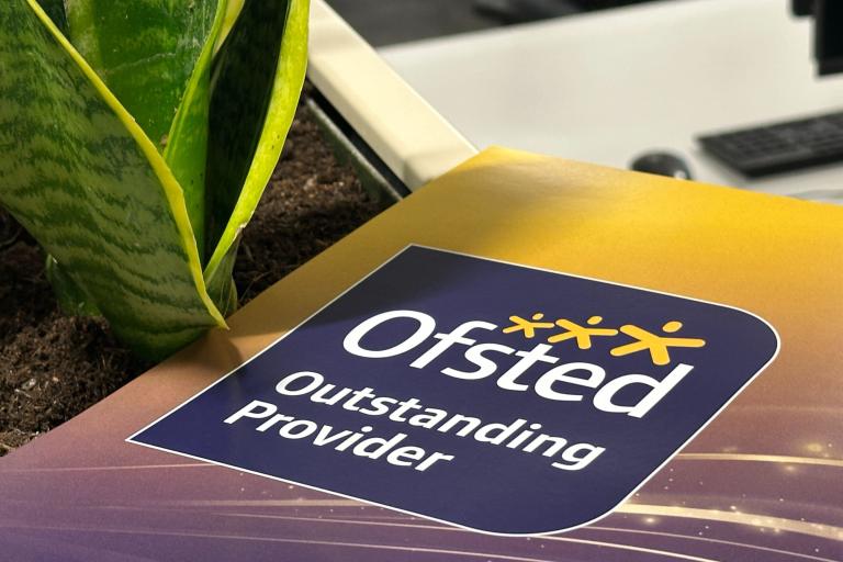 A poster showing the Ofsted Outstanding logo