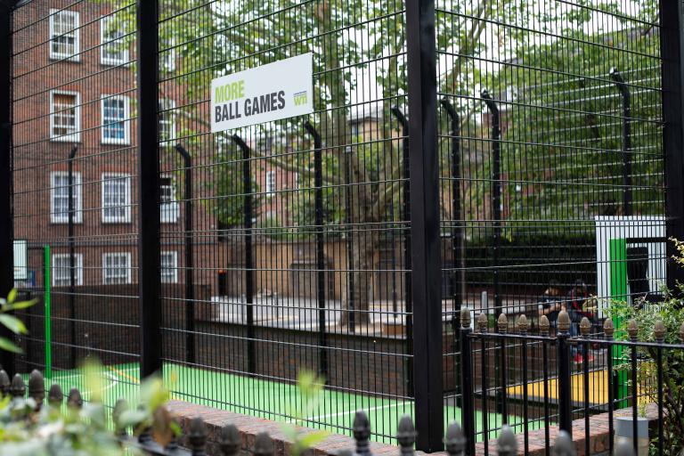 Photo of football cage with saying 'more ball games'