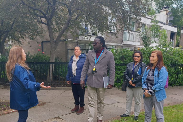 Project manager, resident liaison officer and residents walking around the Silchester Estate discussing the proposed work