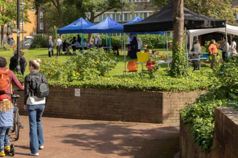 People arriving at an outdoor estate event