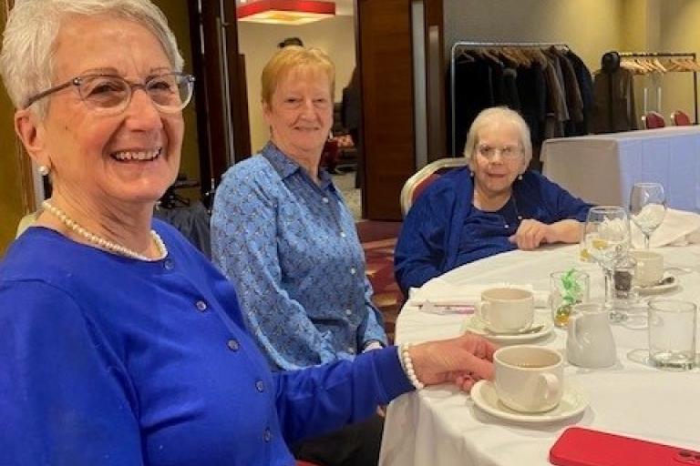 residents at a table enjoying lunch event