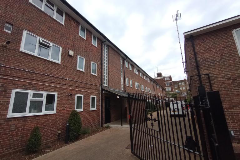 image of The Sandhills building - red brick and new white double glazed windows