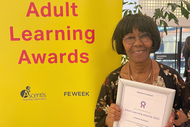 Yvonne Kazeem holding up her certificate