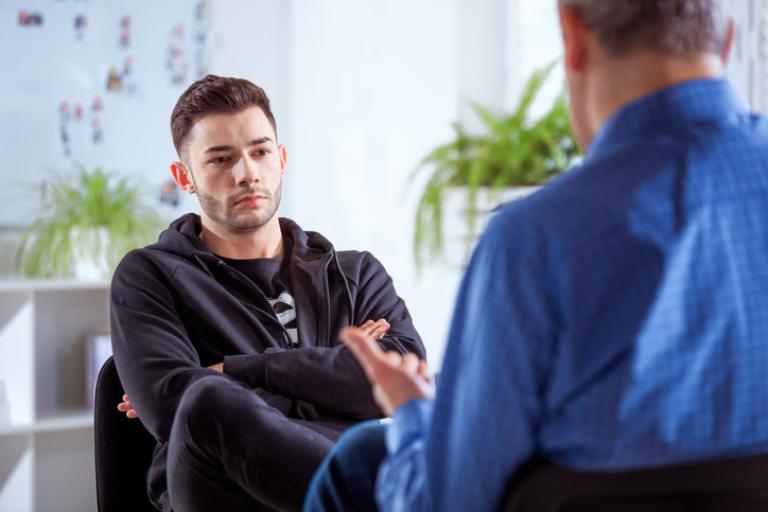 Two men chatting in a room
