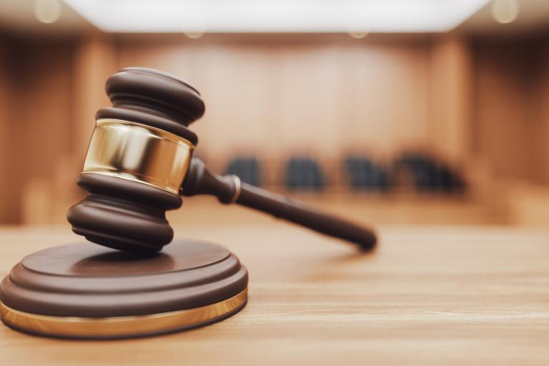 Gavel on a Courtroom Desk