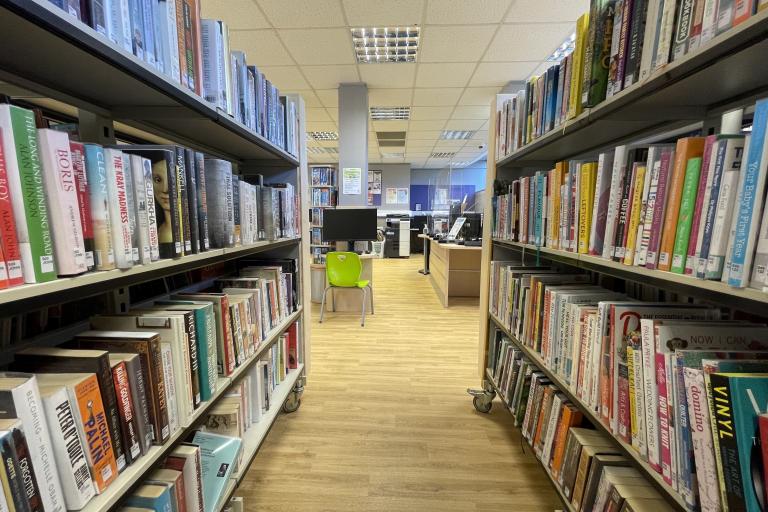 A row of bookshelves in Kensal Library