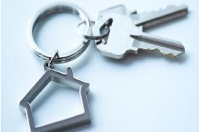 Front door keys on a house-shaped keyring