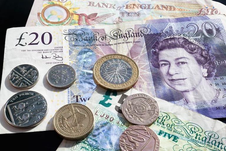 image of five, ten and twenty pound notes and range of coins 