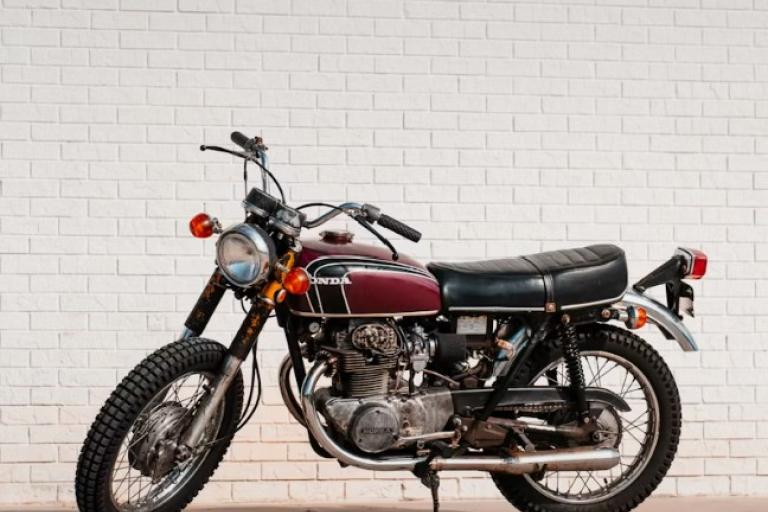 motorbike in front of white wall
