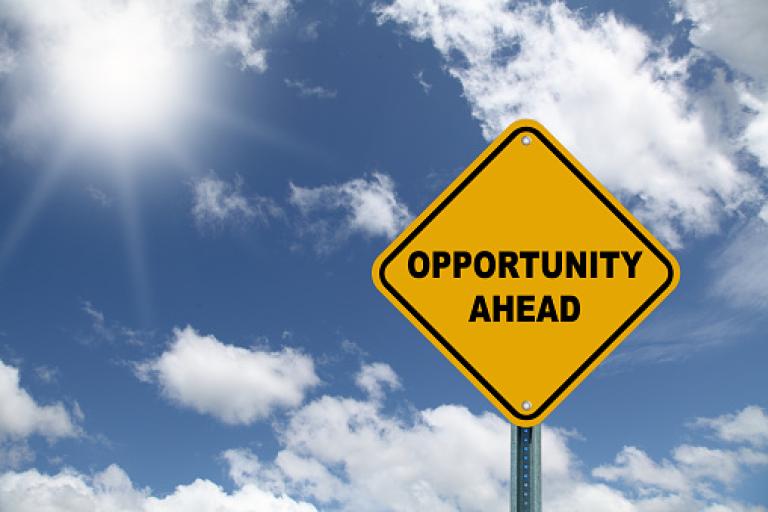 Street sign labelled Opportunity ahead