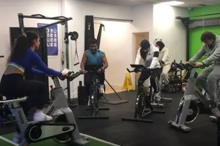 People using machines in a gym