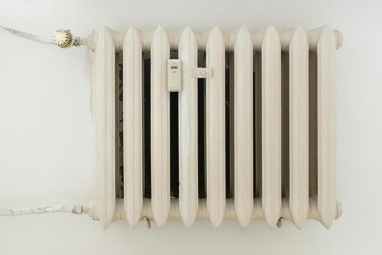 an older radiator with thermostat