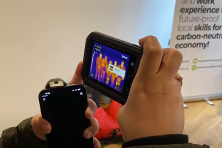 Close up of someone using thermal imaging camera