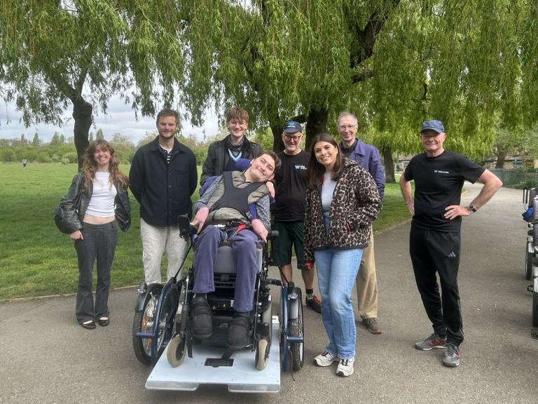 Theo and representatives from the Council, Bikeworks and Lime gather around the new accessible bike. 