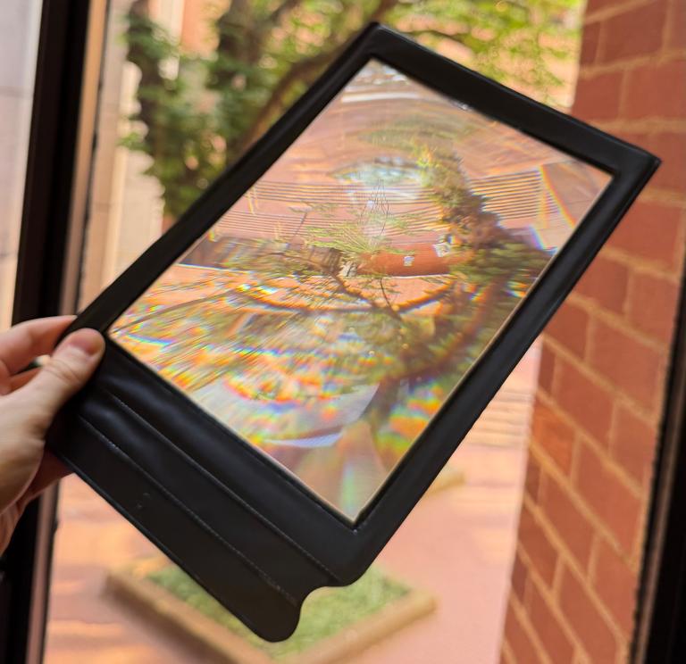 A magnifying sheet residents can use at polling stations 