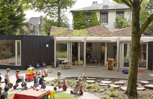 Outside shot of the Montpelier Nursery showing a playground and children playing Outside shot of the Montpelier Nursery showing a playground and children playing